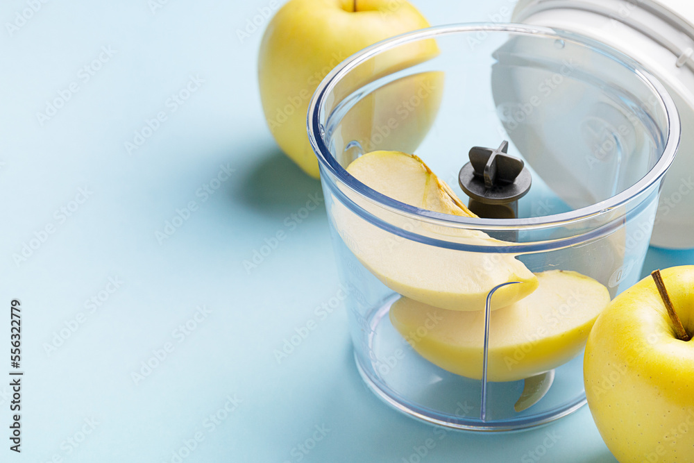 blender with fruits and vegetables on background
blender with fruits and vegetables on background