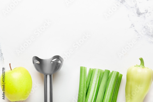 blender with fruits and vegetables on background

 photo