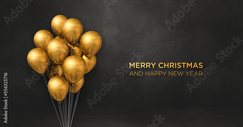 Christmas greeting card. Gold balloons on black background