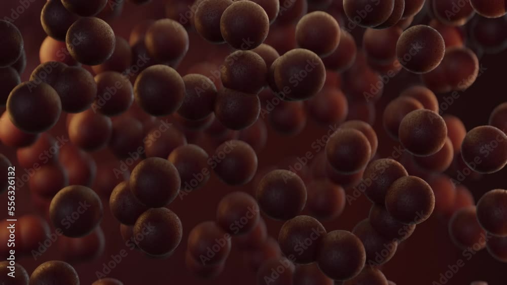 Chocolate spheres falling slowly in loop, brown background, 