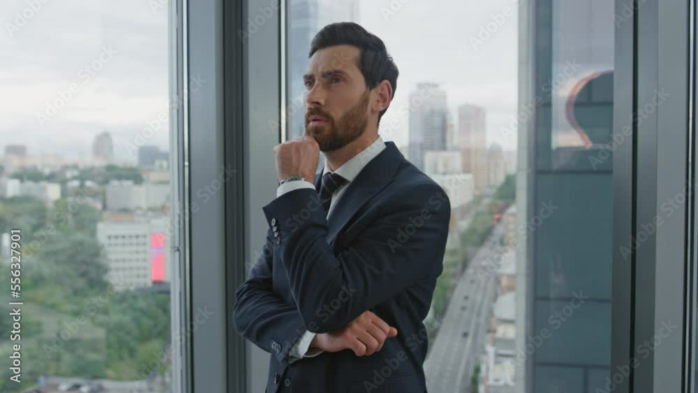 Office manager thinking business ideas near window with cityscape close up. Office manager thinking business ideas near window with cityscape close up.