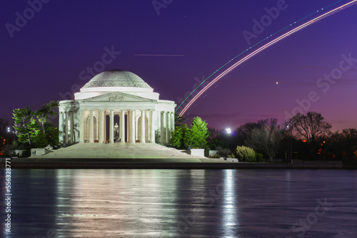 Jefferson Memorial and landing plane light trails during winter sunset - Washington dc united states