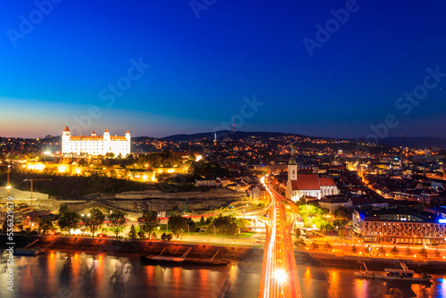View of Bratislava castle, old town and the Danube river from observation deck the bridge in Bratislava, Slovakia at night