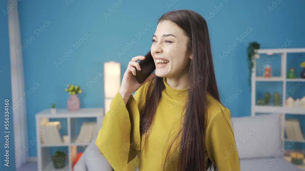 Happy young woman talking on the phone, smiling, white teeth and big passengers. Happy young woman talking on the phone, smiling, white teeth and big passengers.
