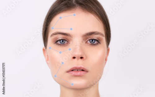 Close-up face of beautiful young woman strong face,BLUE EYES healthy skin, natural make-up, green eyes.WITH CALLOUTS isolated, white background. Skincare facial treatmet female health concept