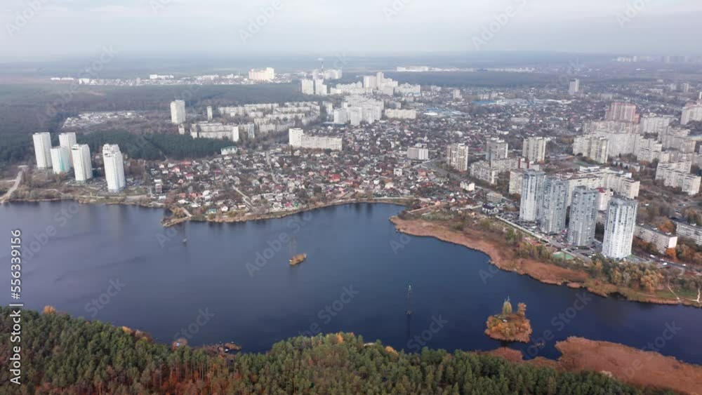 Aerial view of a modern Kyiv architecture in Ukraine. Picturesque panorama of Dnipro River with residential, high-rise buildings along the banks. High quality 4k footage Aerial view of a modern Kyiv architecture in Ukraine. Picturesque panorama of Dnipro River with residential, high-rise buildings along the banks. High quality 4k footage