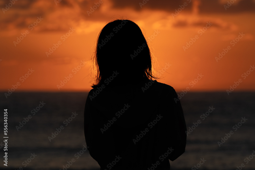 silhouette of person watching sunrise