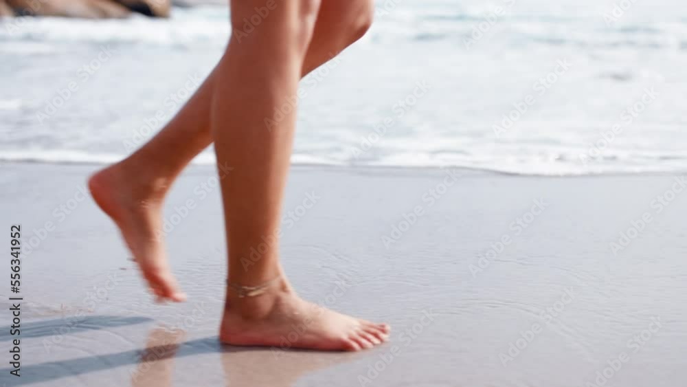 Woman feet, beach and walking on sand for summer vacation, holiday and tropical travel for wellness, freedom and zen lifestyle. Closeup, legs and barefoot on sea shore to relax in peace, calm and sun Woman feet, beach and walking on sand for summer vacation, holiday and tropical travel for wellness, freedom and zen lifestyle. Closeup, legs and barefoot on sea shore to relax in peace, calm and sun