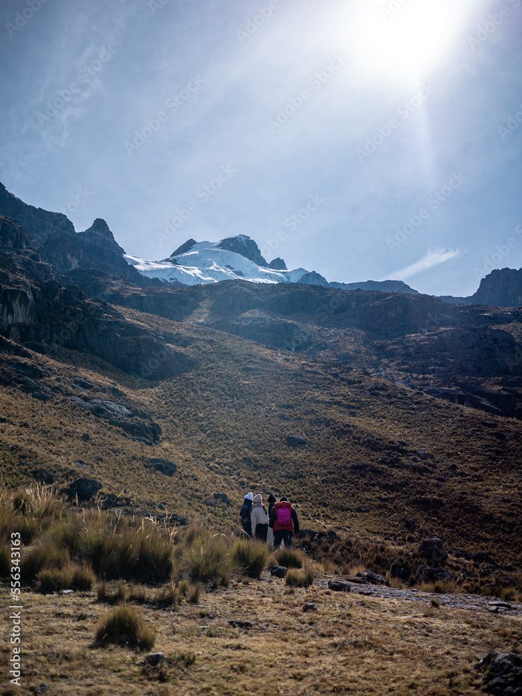 tourists walking towards the glacier on a mountain, in peru south america