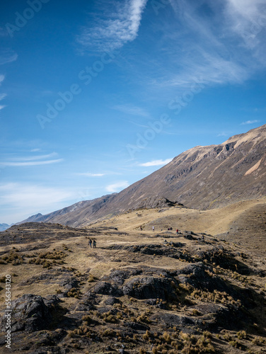 tourists walking towards the glacier on a mountain, in peru south america