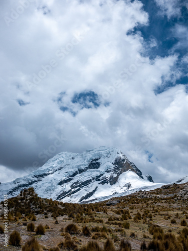 Glacier, rock mountain and blue sky in Peru South America