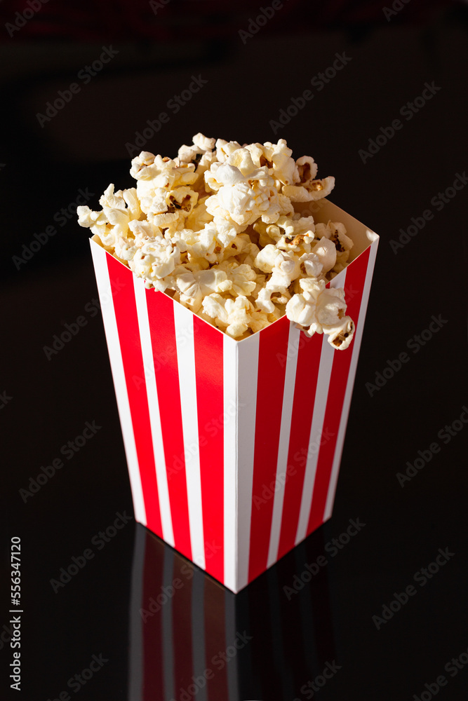 popcorn box on black glossy background
