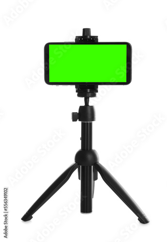 Smartphone with green screen fixed to tripod on white background. Mockup for design