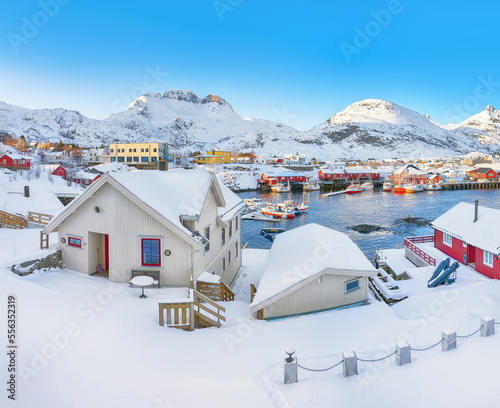Astonishing snowy morning cityscape of Sorvagen town.