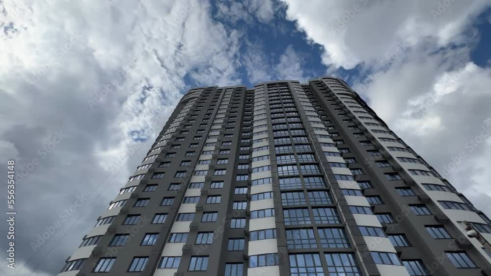 Bottom up view of a newly built modern high-rise apartment building exterior Bottom up view of a newly built modern high-rise apartment building exterior