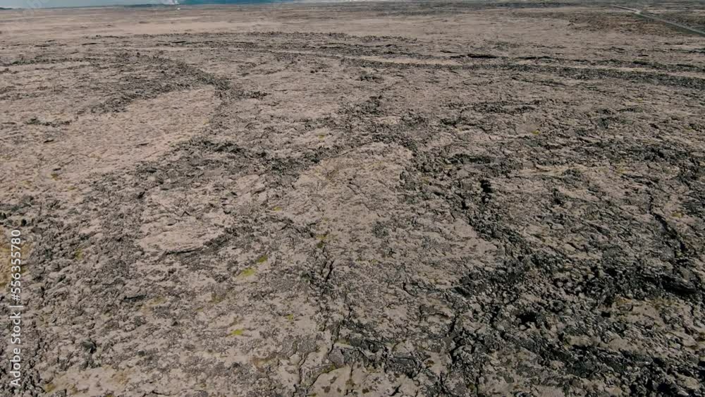 Wide, plain area covered with lava fields. Fast descent