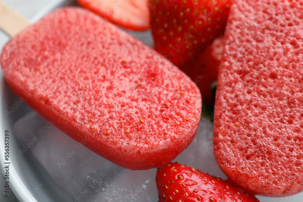 Tasty strawberry ice pops in bowl, closeup. Fruit popsicle Tasty strawberry ice pops in bowl, closeup. Fruit popsicle