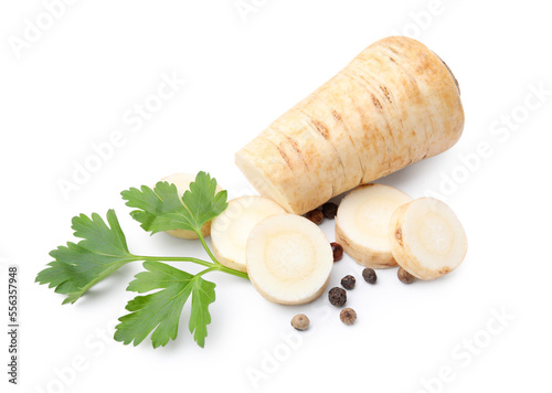 Whole and cut raw parsley root, fresh herb isolated on white
