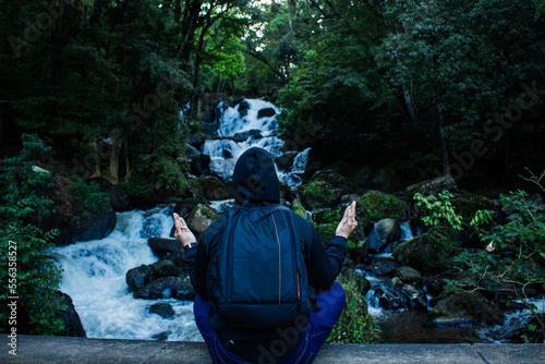 Person in nature with Buddha pose