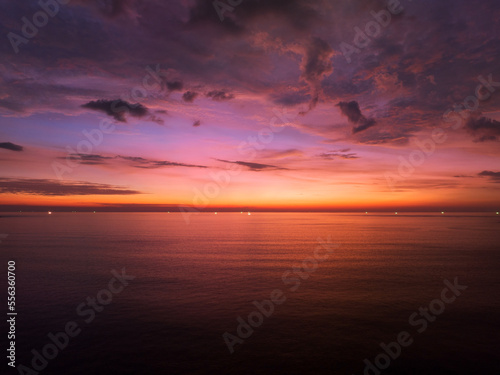 Aerial view sunset sky, Nature beautiful Light Sunset or sunrise over sea, Colorful dramatic majestic scenery Sky with Amazing clouds and waves in sunset sky purple light cloud background © panya99