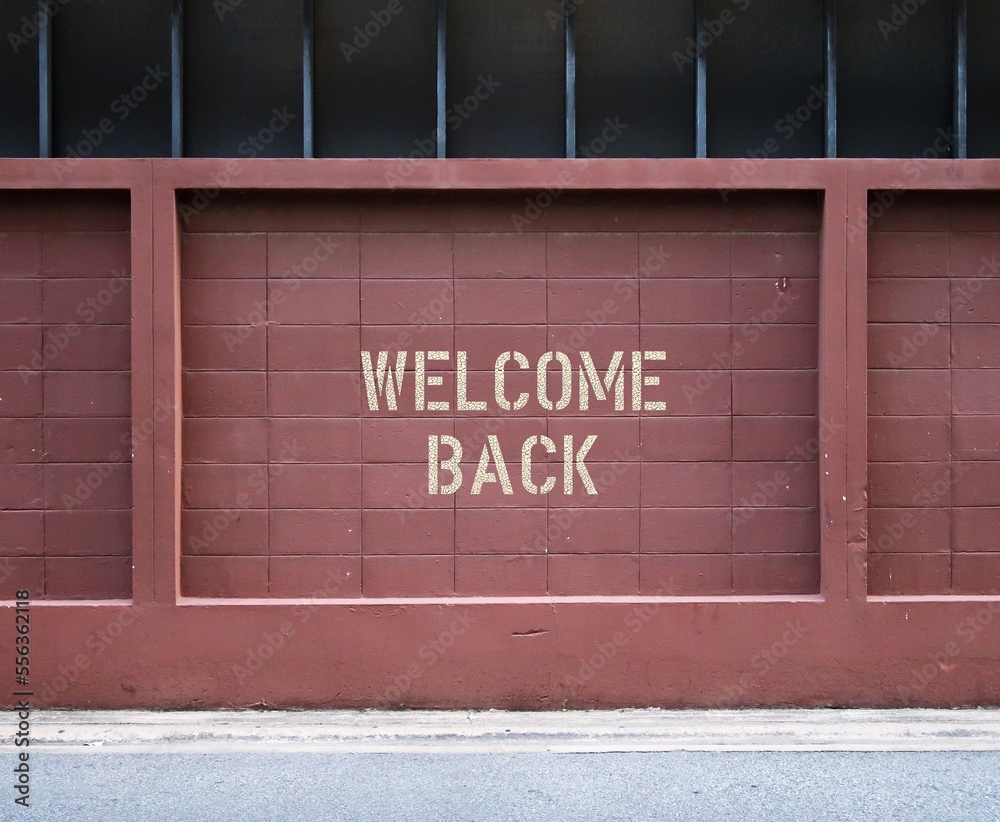 Brown wall in city with text inscription WELCOME BACK, concept of business re-opening again after renovation or pandemic lock down, welcome back greeting to customers, visitors or travelers