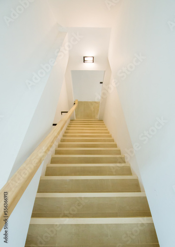 Perspective view of down to wooden stairs