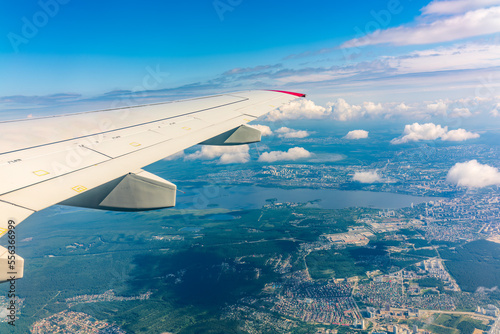 View from the airplane window during taking off on a clear summer morning. Yekaterinburg, Russia