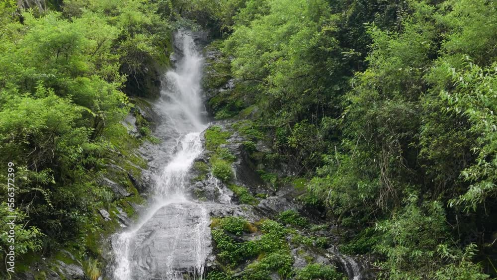 Beautiful waterfall in green forest. Small waterfall with crystal clear water. Tropical in mountain jungle. Stream running. Beautiful waterfall in green forest. Small waterfall with crystal clear water. Tropical in mountain jungle. Stream running.