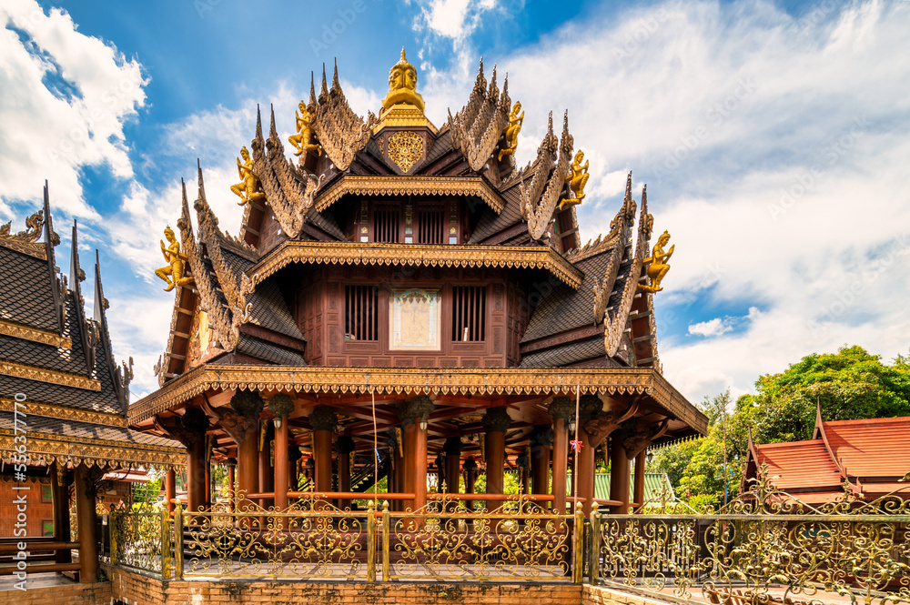 Naklejka premium Bangkok, Thailand, August 21, 2022 : Wat Sangkathan. Outside of the wooden chapel ( Buddhist temple ) area.