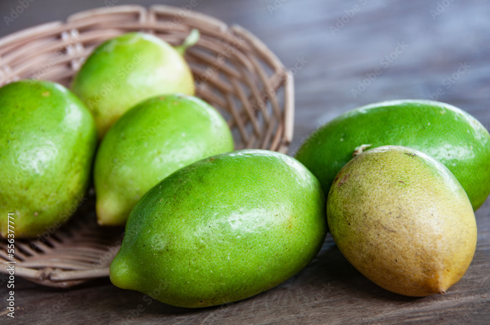 Close up of lemons on wooden basket. Asian food concept. Close up of lemons on wooden basket. Asian food concept.