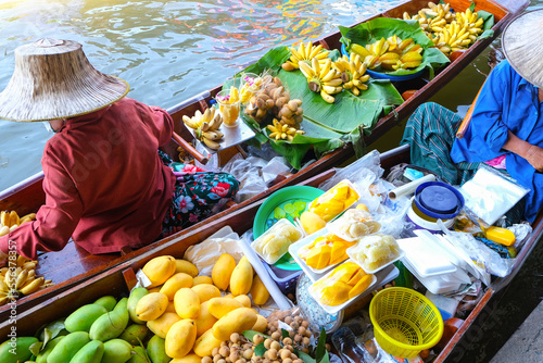 Famous Damnoen Saduak floating market in Thailand, Farmer goes to sell organic products, fruits, vegetables and Thai food, Ratchaburi province tourism concept. Thailand photo