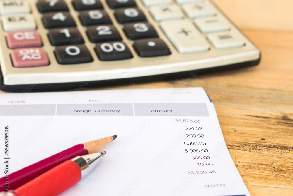 statement of bank for check expensive credit card with calculator arrangement flat lay style on background wooden statement of bank for check expensive credit card with calculator arrangement flat lay style on background wooden