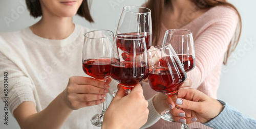 Friends clinking glasses of...