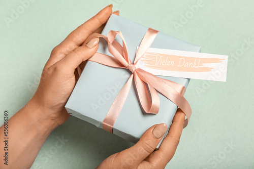 Woman holding gift box with...