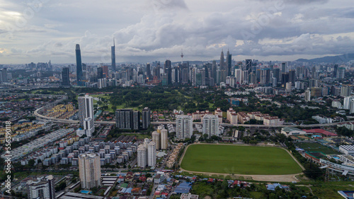 Photography Modern Skyscraper and Traditional Housing Area at Kuala Lumpur, Malaysia