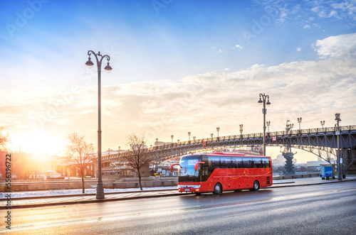 Red bus "Unforgettable Moscow" on the Prechistenskaya Embankment of the Moscow River, Patriarchal Bridge, Moscow