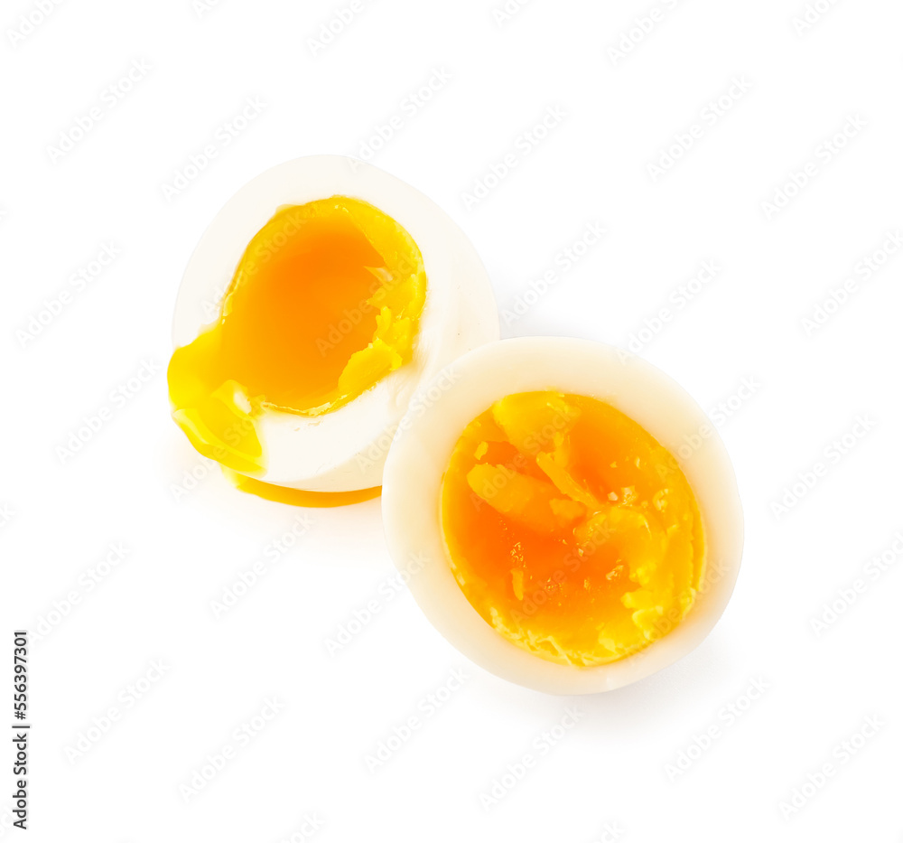 Sliced soft boiled eggs on white background