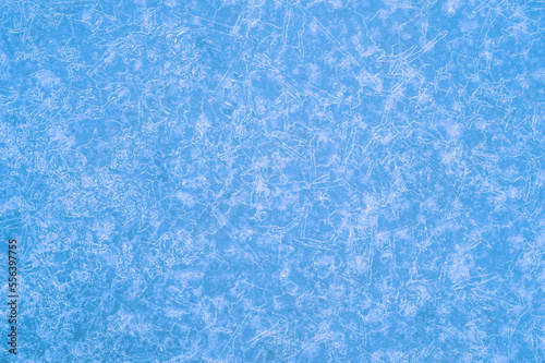 Pure blue ice in a luminous pattern of beautiful frost veins. Background concept