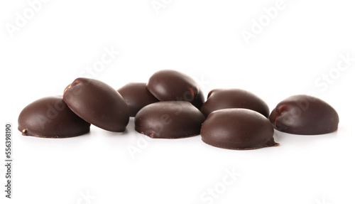 Heap of chocolate bird's milk candies on white background