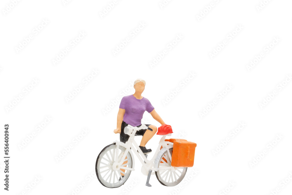 Miniature people , Cyclist with a saddle bag isolated on white background with clipping path Miniature people , Cyclist with a saddle bag isolated on white background with clipping path