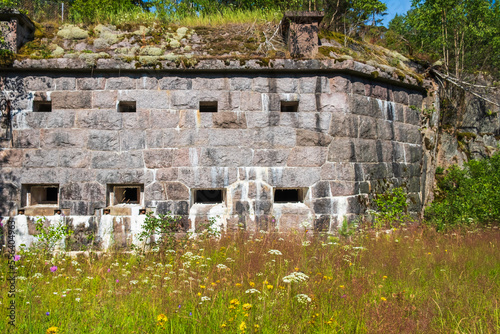Caponier in a moat with a flowering summer meadow