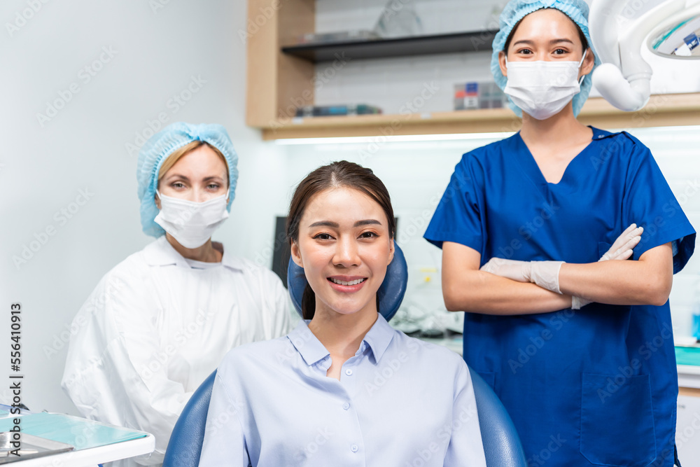Portrait of Asian young woman patient and dentist at health care clinic. Portrait of Asian young woman patient and dentist at health care clinic.