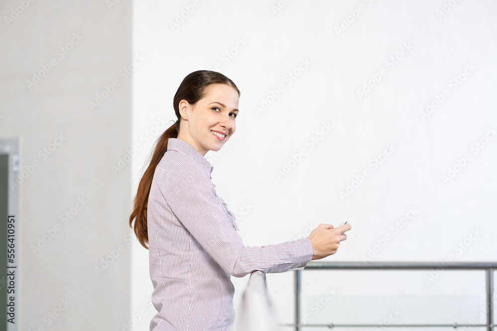 young attractive woman with phone in her hands young attractive woman with phone in her hands