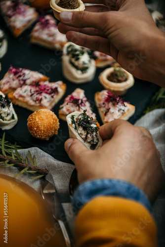 Delicious appetizers are served on a decorated table during a wedding event.