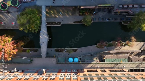 Top down aerial of riverwalk canal in USA. Bridge road over waterway. photo