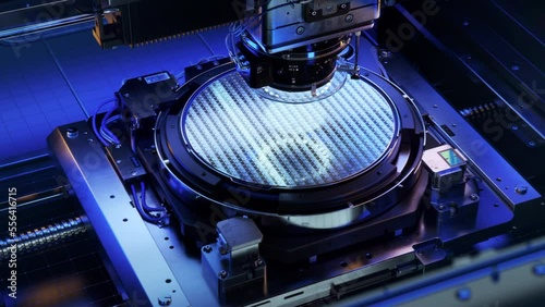 Silicon Wafer during Photolithography Process. Shot of Lithography Process that allows to Create Complex Patterns on a Wafer during Semiconductor and Computer Chip Manufacturing at Modern Foundry. 