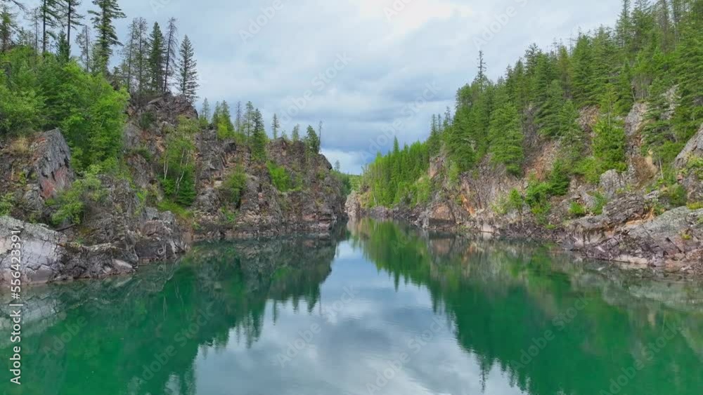 Mirror Reflections Through Flathead River Near Glacier National Park In Montana, United States. Aerial Shot Mirror Reflections Through Flathead River Near Glacier National Park In Montana, United States. Aerial Shot