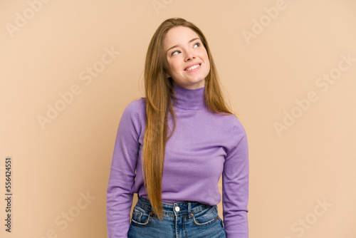 Young redhead woman cut out isolated relaxed and happy laughing, neck stretched showing teeth.