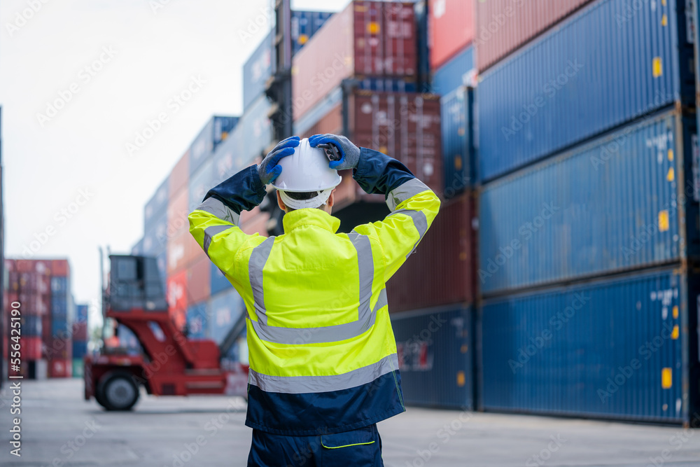 Fototapeta premium Engineer container cargo checking stock into container for loading,logistic and business export.