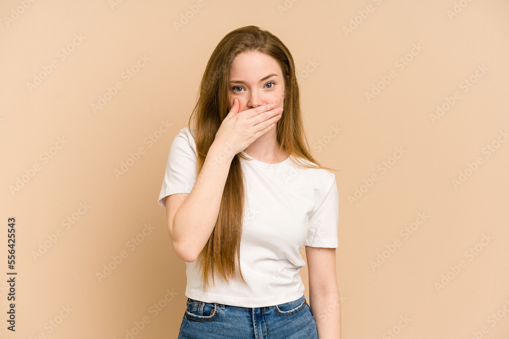Young redhead woman cut out isolated covering mouth with hands looking worried. Young redhead woman cut out isolated covering mouth with hands looking worried.